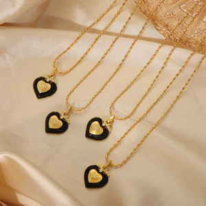 Gold-plated titanium steel necklace with black enamel heart pendant and zircon accents