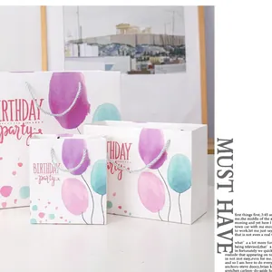Three-piece set of white birthday gift bags with pastel watercolor balloon patterns