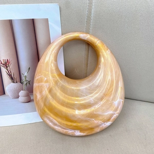 Chic round gold marble acrylic handbag with wavy texture and hollow circular handle