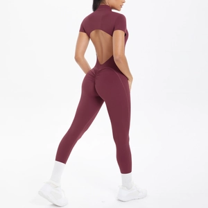 Macro view of burgundy short sleeve bodysuit featuring an open back and ruched butt lift