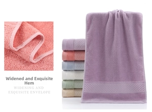 Detailed macro view showing the widening exquisite envelope edging on soft cotton bath towels