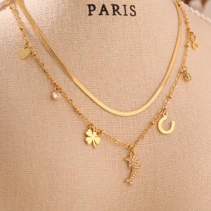 Gold layered necklace with dolphin heart clover charms and zircon stones for women