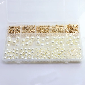 Detail view of 15-grid organizer box with mixed gold spacer beads and white ABS pearls
