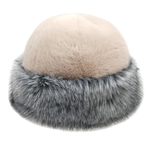 Faux fur winter bucket hat in beige and grey gradient featuring a thick warm plush design