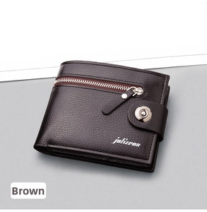 Macro detail of the brown leather wallet showing litchi texture and zip pocket