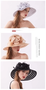 Detailed view of elegant mesh sun hats with large floral accents in white beige and black