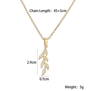 Detailed view of gold leaf pendant with dimensions 2.9cm by 0.7cm on white background