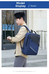 Deep blue business laptop backpack with side USB charging port and sleek patchwork design