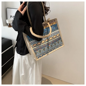 Detail of bohemian tote bag featuring geometric patterns and sturdy rope handles