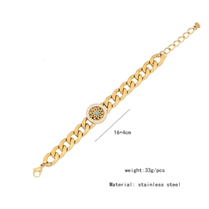 Detail of gold stainless steel bracelet with green stone pendant and crystal accents