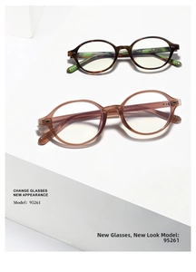 Macro detail of oval tortoiseshell and amber frames on white geometric platforms
