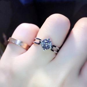 Detailed close-up of a high carbon diamond ring with round brilliant cut and silver band
