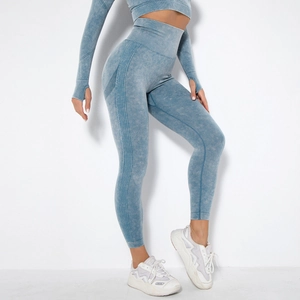 Detailed texture of seamless washed dark blue yoga set featuring thumbholes and ribbed trim