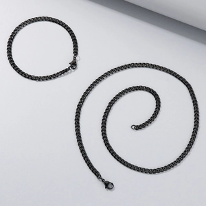 Ensemble collier et bracelet à mailles gourmette noires en acier avec fermoir homard