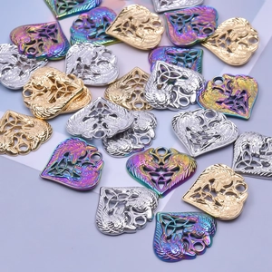 Detailed heart pendants with wolf head motif in gold, silver and rainbow finishes