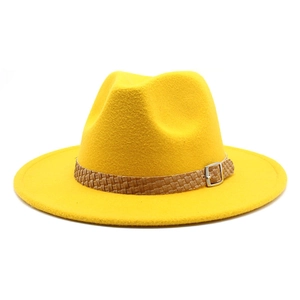 Macro detail of bright yellow felt fedora hat with brown braided faux leather band