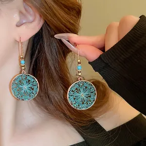 Bohemian hollow floral starfish earrings with turquoise enamel and bronze finish