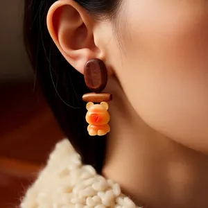 Retro wooden bear pendant earrings for women featuring brown oval and orange resin bear