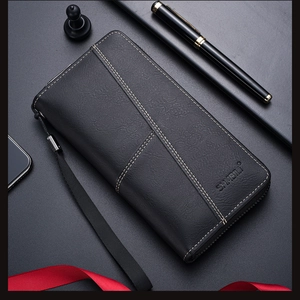 Detailed close-up of a long black leather men's wallet with white stitching and wrist strap