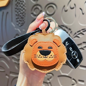 Handcrafted leather lion keychain charm with lychee texture and black wrist strap