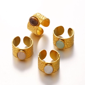 Minimalist gold-plated stainless steel oval rings with hammered texture and colorful gemstones