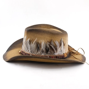 Detail of woven straw cowboy hat featuring natural feathers and colorful bead accents