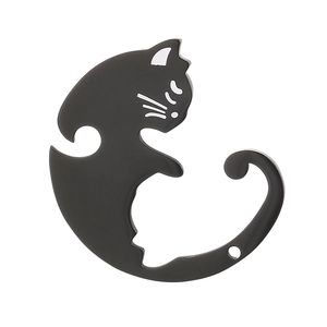 Detailed view of a sleek black cat-shaped pendant with a curved tail hook and white accents