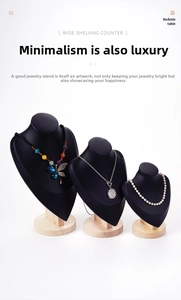 Three-piece black matte necklace display busts with round wooden bases in staggered heights