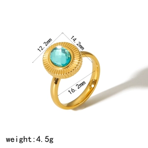 Detail view of gold stainless steel sunburst ring with blue stone and dimension labels