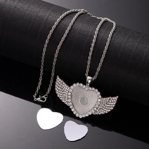 Detailed view of silver heart wing necklace with rhinestones and sublimation blanks