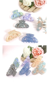 Collection of multi-colored acrylic bow hair claws with marble texture on white background
