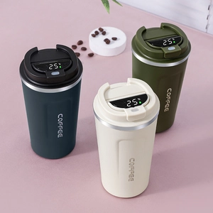 Three smart coffee mugs with LED temperature display in blue, beige, and green colors