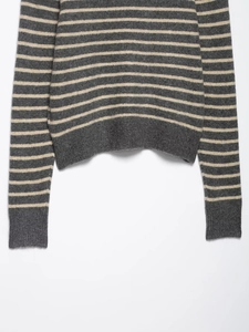 Detailed view of the fine texture on this grey and beige striped knit cardigan sweater