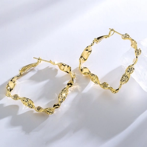 Chic 18K gold plated copper earrings with a unique geometric wavy distortion design