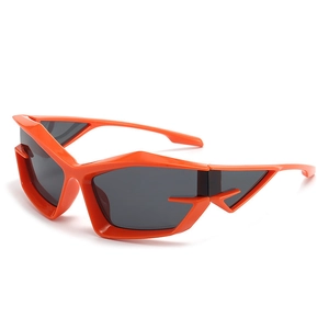 Futuristic orange Y2K sunglasses with dark grey lenses and geometric frames for a trendy look