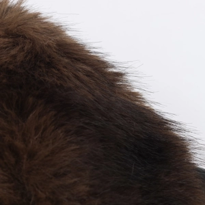 Close-up of premium dark brown faux fur texture used for winter coat collars and cuffs