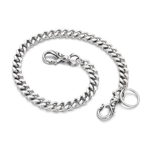 Polished silver cuban link pants chain with skull lobster clasp and key ring on white