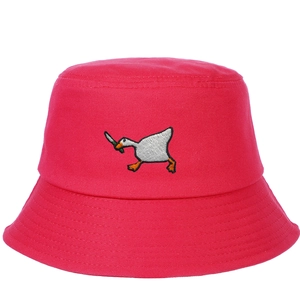 Close-up of high-quality embroidery featuring a goose with knife on red cotton bucket hat