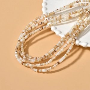 Macro shot of 4mm irregular natural shell spacer beads for DIY jewelry making