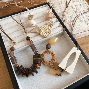 Bohemian geometric necklace set with wooden beads and woven rattan round pendants