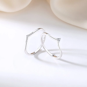 Minimalist S925 sterling silver V-shaped rings with micro diamonds set on white background