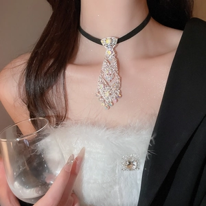 Close-up of black ribbon choker with sparkling rhinestone tie fringe on a fashion model