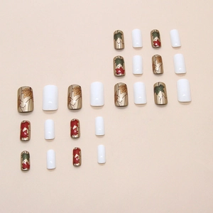 Autumn-themed press-on nails featuring red maple leaf designs and pure white glossy finish
