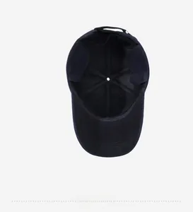Detailed inner lining view of a navy blue winter baseball cap with ear protection