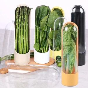 Herb preservation containers in various colors on a marble countertop with fresh asparagus