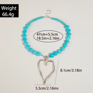 Detail shot showing product dimensions and weight for chunky blue heart necklace