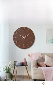 Minimalist round wall clock with wood texture and golden numbers in a living room setting