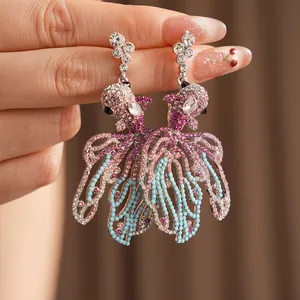 Exquisite gold goldfish earrings with colorful crystals and shimmering rhinestones