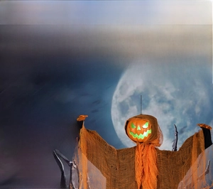 Close-up of Halloween hanging pumpkin ghost with glowing eyes and sound activation