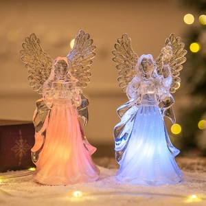 Pair of glowing acrylic Christmas angel ornaments with warm orange and cool blue LED lights